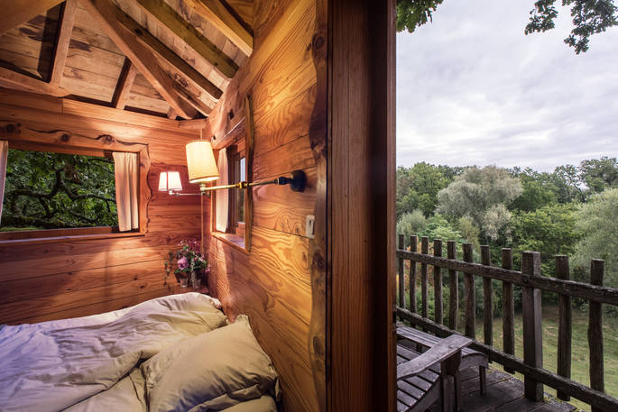 Take in the view from the bedroom at Gauthie Treehouse Cabin, Dordogne, France