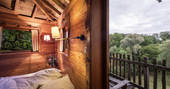 Take in the view from the bedroom at Gauthie Treehouse Cabin, Dordogne, France