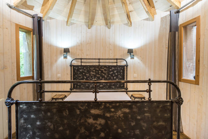 Double bed at Hautefort Treehouse, Châteaux dans les Arbres, Dordogne, France