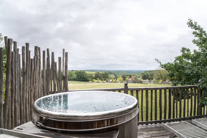 Relax in the hot tub and soak in the view at Monbazillac Treehouse, Châteaux dans les Arbres, Dordogne, France