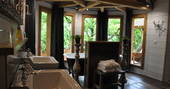Puybeton treehouse dordogne france europe european glamping holidays interior cosy rustic pretty airy bathroom with bath