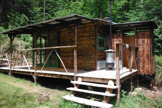 covert cabin timber cabin exterior shower and toilet hut 