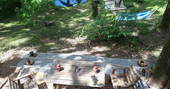 Settle in and relax on the decking at Woodman's Cabin in Dordogne, France