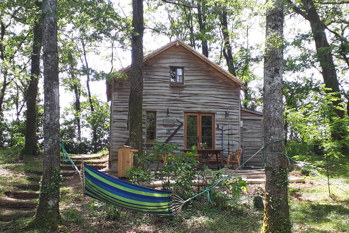 The handcrafted wooden exterior of the Woodman's Cabin in Dordogne, France