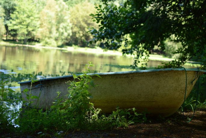 Little boat on the side of the lake at GoGreen holidays, Saint Priest Les Fougeres, Dordogne, France