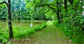 Take a walk around the private lake at GoGreen Roulette in Dordogne, France