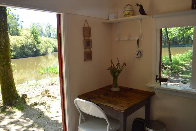 Seating area just inside GoGreen Roulotte with front door next to it