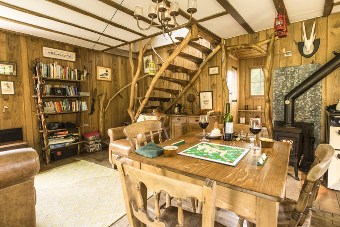 The interior with it's unique wood-crafted interiors at Poacher's Cabin in Dordogne, France
