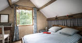 The master bedroom at Poacher's Cabin in Dordogne, France