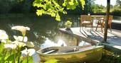 Caru Cabin decking, boat, pond and lilies, Terre et Toi, St Geraud de Corps, Dordogne, France 10