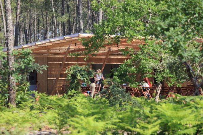 Communal kitchen and terrace area at Cap Cabane, Gironde, France