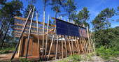 Exterior view of shower hut at River Treehouse, Gironde