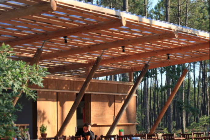 Communal kitchen and terrace area at Cap Cabane, Gironde, France