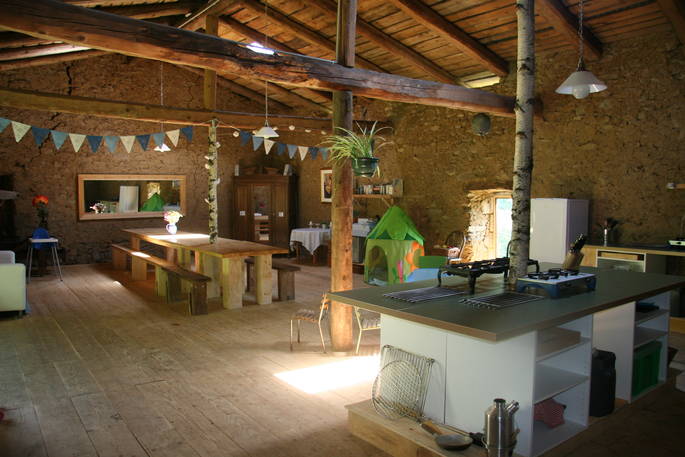 Barn kitchen and dining area at Cherry Blossom Yurt, Haute-Loire