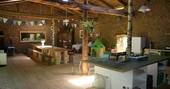 Barn kitchen and dining area at Cherry Blossom Yurt, Haute-Loire