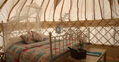 Double bed interior at Cherry Blossom Yurt, Haute-Loire