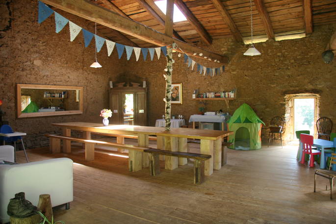Barn kitchen and dining area at Forget-me-not Yurt, Haute-Loire