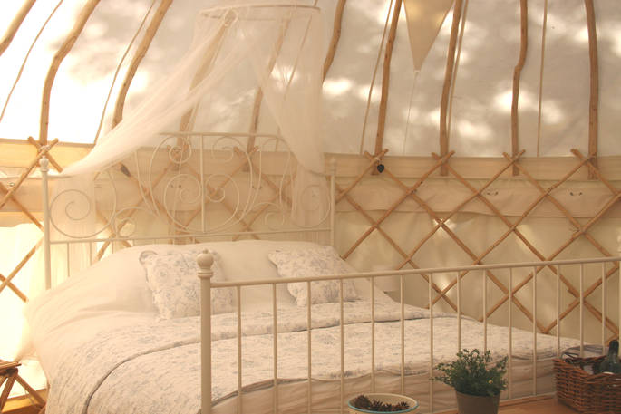 Double bed interior at Forget-me-not Yurt, Haute-Loire