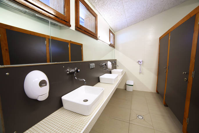 Communal shower block for guests at Bot-Conan Lodge in France