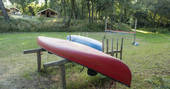 Canoes on the field at Bot-Conan Lodge in France