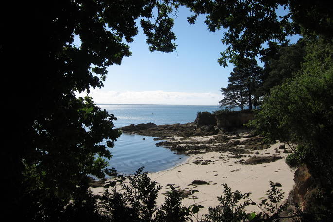 Bot-Conan beach seen through the trees in France