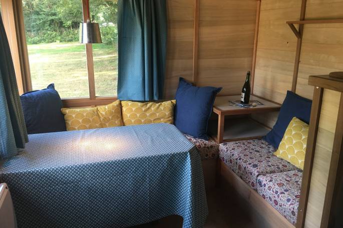 Seating area in the corner of La Cabane de Bot-Conan in France