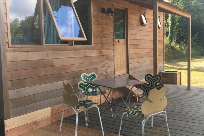 Sit and relax on the wooden decking out of La Cabane de Bot-Conan in France