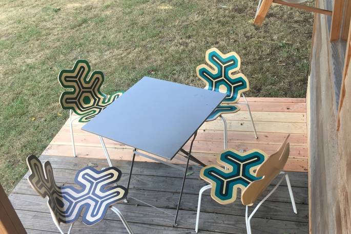 Wooden seating outside of La Cabane de Bot-Conan