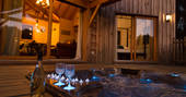Soak in the outdoor hot tub at night with a glass of champagne at Sommet de Memanat in France