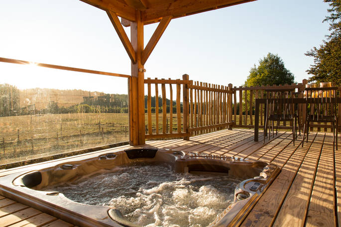 Sommet de Memanat treehouse sunken hot tub on the elevated terrace with stunning views of the french countryside 