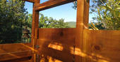 Outdoor wooden private shower for Mount Kenya guests at Le Camp in France