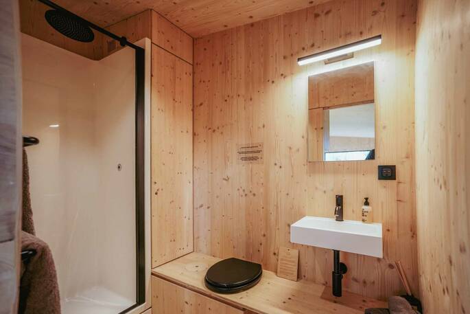 Bathroom with a hot shower, compost loo, and sink