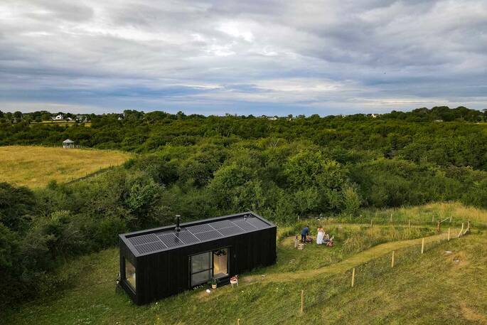 Front exterior of cabin and garden area