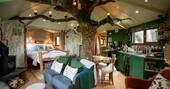 Open plan interior with the tree running through