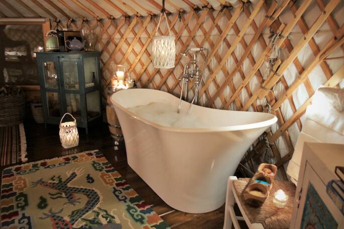 italian yurt interior with freestanding bath tub