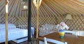 handcrafted mongolian yurt holiday italy interior bedroom and woodburner 