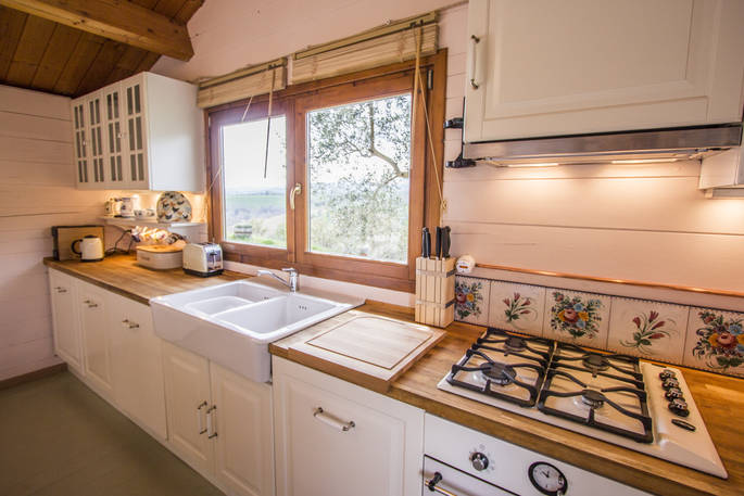 The Pool House fitted kitchen with views of Glamping Abruzzo's biodynamic olive farm 