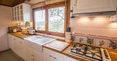 The Pool House fitted kitchen with views of Glamping Abruzzo's biodynamic olive farm 