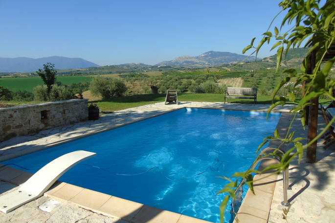 The private outdoor swimming pool at The Pool House with stunning mountain views and Abruzzo countryside 