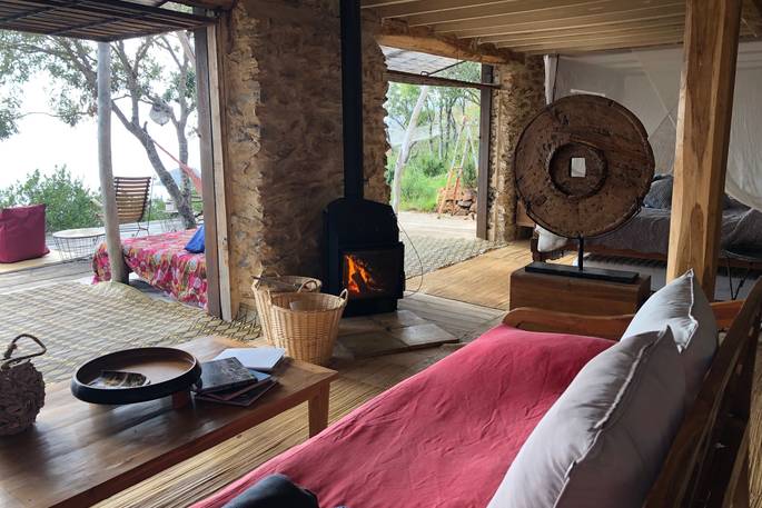 Living area with wood burner at La Casetta Sul Mare, Tuscany, Italy