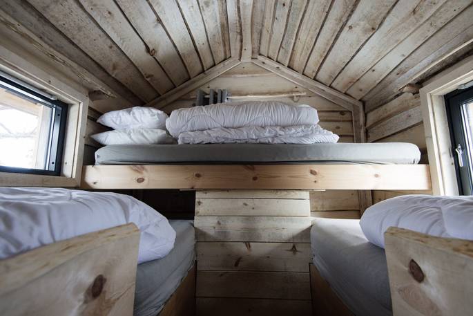 Three single beds at the top of the tree house in Norway 