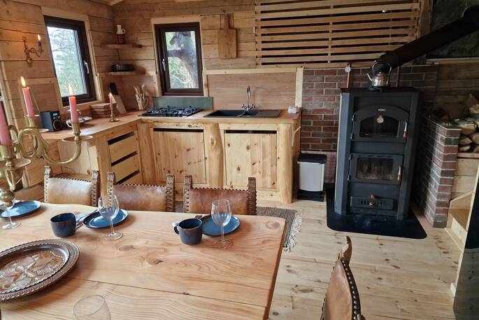 Kitchen equipped with gas hob and wood burner oven and stove