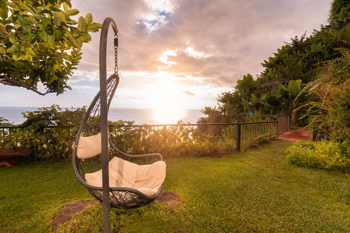 Rock on the outdoor hanging seat watching the sun set at Canto das Fontes in Madeira