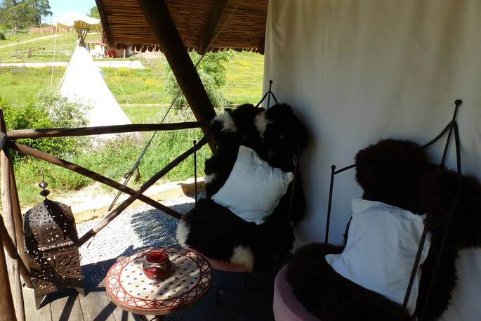 Relax on your private outdoor terrace at Desejo Tent, A Terra