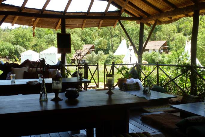 Communal shaded seating area at A Terra
