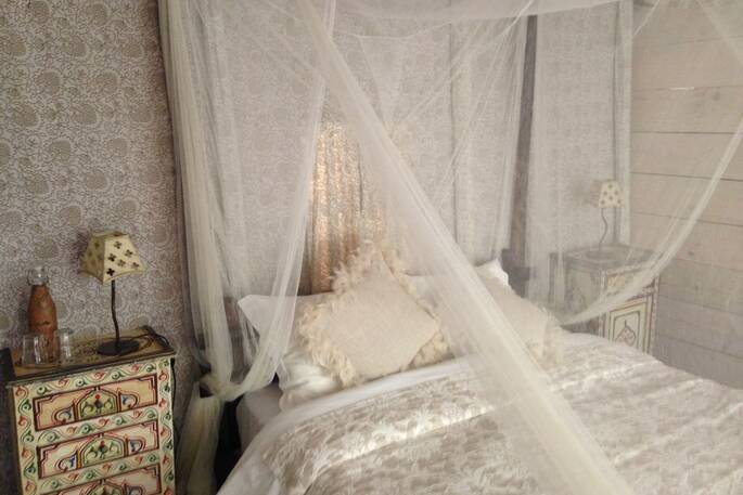 Beautiful interiors and comfortable double bed inside Desejo safari tent at A Terra