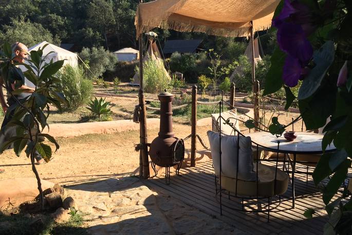 Relax with a drink on the sunny outdoor terrace at A Terra in Portugal