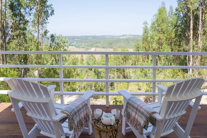 Enjoy a morning up of tea or coffee from the elevated deck of Camomila treehouse with far-reaching views of Alentejo countryside 