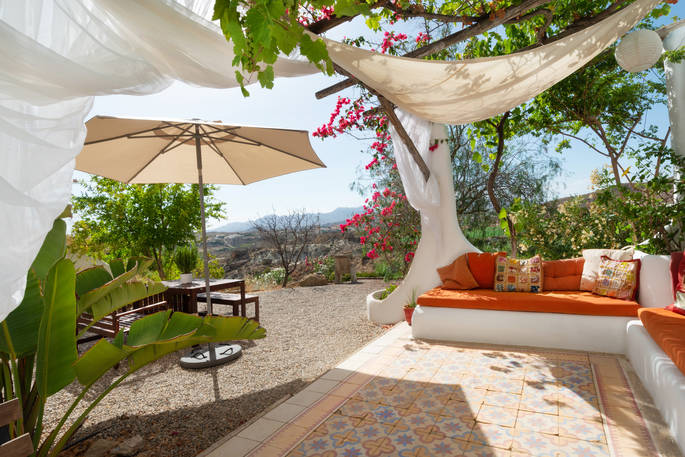 Sit out on the terrace outside of Casa Isadora Cave House and enjoy the views overlooking Almeria in Spain