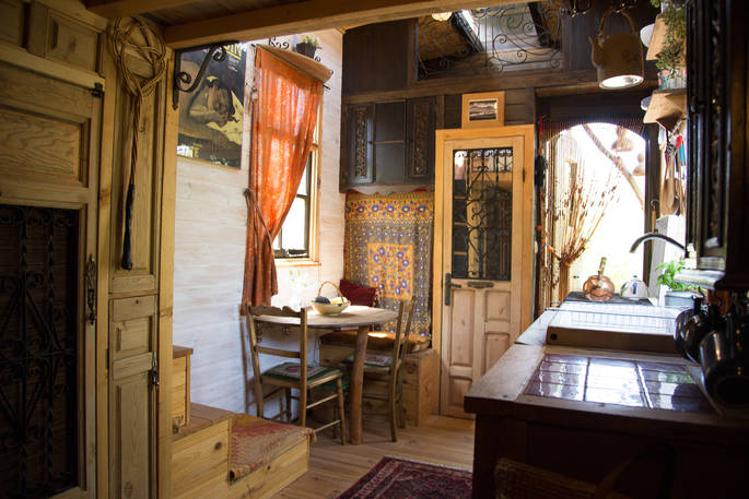 Fully equipped kitchen and dining area inside The Little Wooden House in Malaga Spain